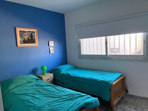 Ένα ή περισσότερα κρεβάτια σε δωμάτιο στο Barrio el Trebol A1
