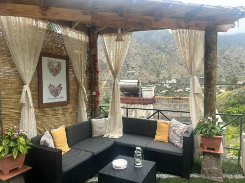 a couch on a patio with a view of a mountain at Casa Jonay in Hermigua