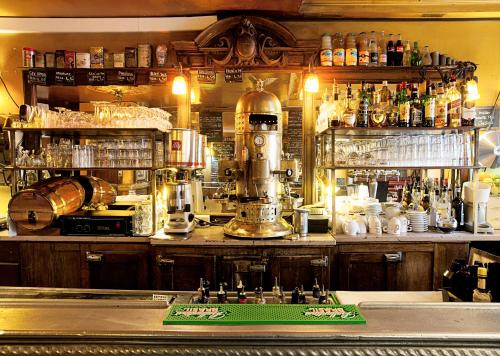 a bar with a coffee maker on top of a counter at Bistrot Les Sans Culottes in Paris