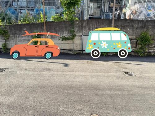 two toy cars are parked in a parking lot at Civetta BLU, Blue Owl Apartments in Trento