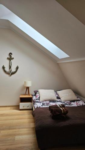 Posteľ alebo postele v izbe v ubytovaní Apartament Bursztynowy