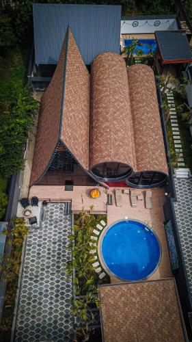 an overhead view of a large building with a swimming pool at Qafqaz Rolling Bungalow HOT POOL in Gabala