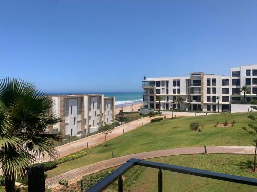a view of the beach from the balcony of a apartment at Prestigia plage des Nations in Sale