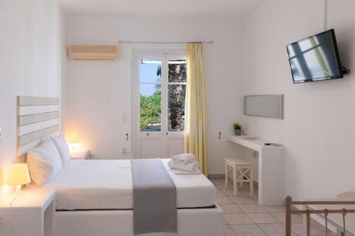 Кровать или кровати в номере Morpheas Pension Rooms & Apartments