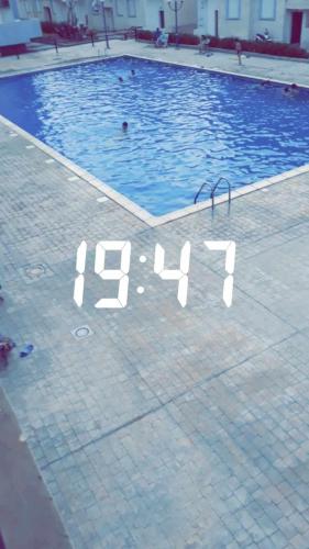 a large swimming pool with the year on it at Taida in Tizouiar