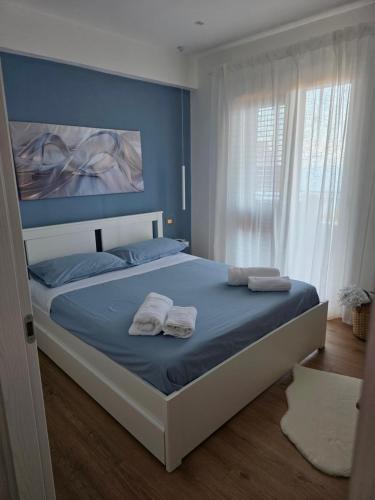 Ένα ή περισσότερα κρεβάτια σε δωμάτιο στο Giaele Home