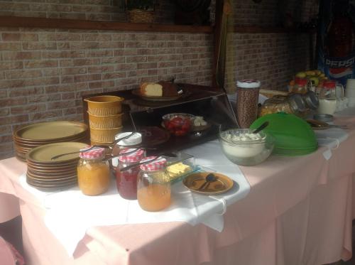 a white table with food and drinks on it at Panorama in Skafidia