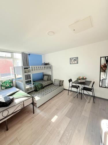 a living room with a couch and a table at Little Venice Guest Rooms in London