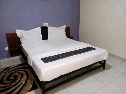 Кровать или кровати в номере KEMI Hôtel