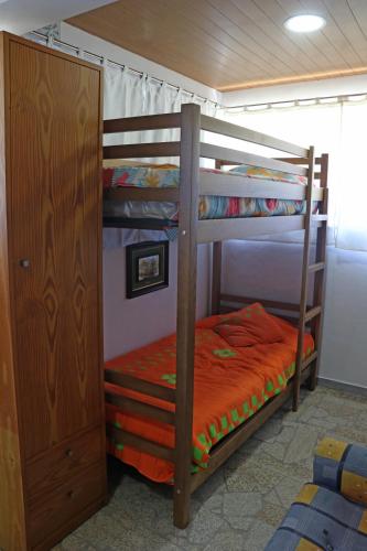 a couple of bunk beds in a room at Casa do Monte in Castro Daire