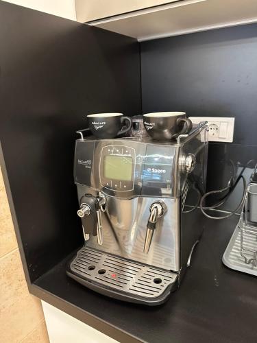 a coffee maker is sitting on a counter at Centar Lux 3M in Zlatibor