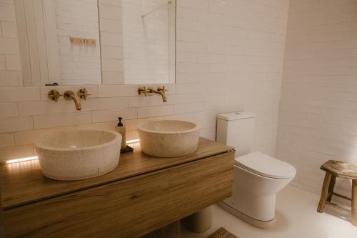a bathroom with a sink and a toilet at Beige Tranquil Escape by the Sea in Matosinhos