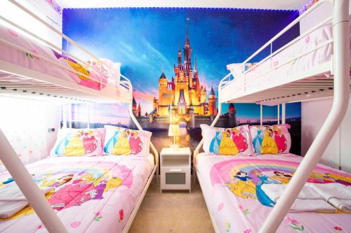 a bedroom with a castle and two bunk beds at Exclusive 8BR Family Villa - Pool, BBQ, Game Room & Themed Bedrooms! in Kissimmee