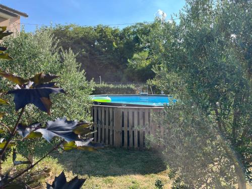 a swimming pool in a yard with trees at Guest House Al Capitello 