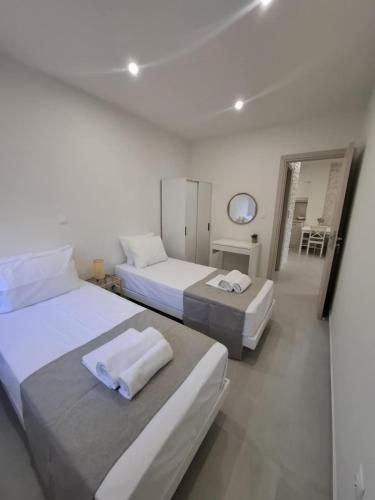 Ένα ή περισσότερα κρεβάτια σε δωμάτιο στο EmvaSea Seaside apartment