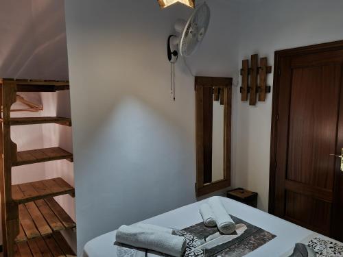 a room with a table with towels on it at Molino Romano in Alcalá del Valle