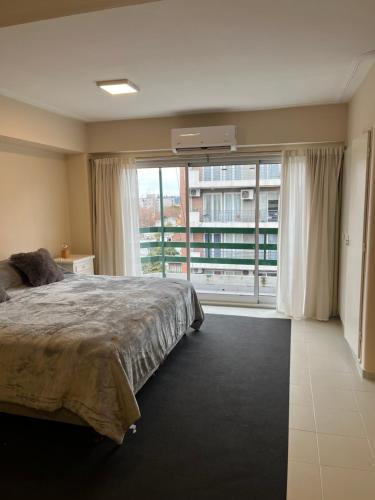 Ένα ή περισσότερα κρεβάτια σε δωμάτιο στο Dpto SANTIAGO