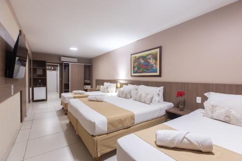 Postel nebo postele na pokoji v ubytování Amuarama Hotel