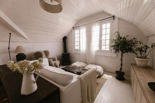 a living room with a couch and a table at Beige Tranquil Escape by the Sea in Matosinhos