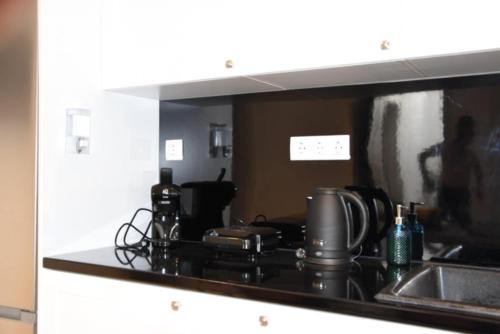 a kitchen with a sink and a counter top at heliaia2 in Naxos Chora