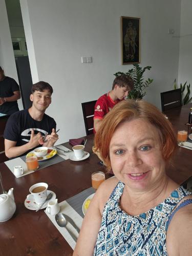 a woman sitting at a table with a man at Aquahills in Kandy