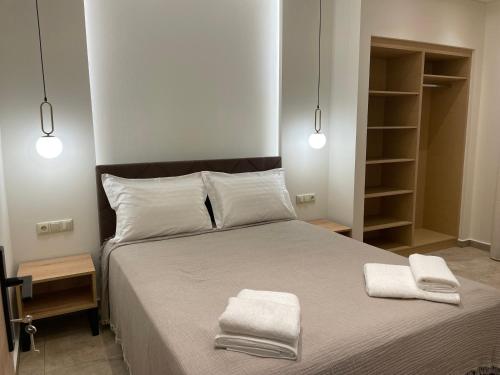 Postel nebo postele na pokoji v ubytování Tsoukos Apartments