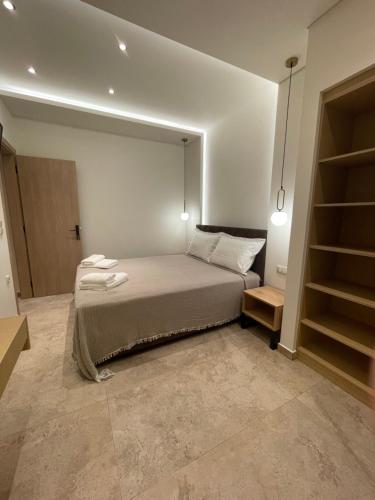 Postel nebo postele na pokoji v ubytování Tsoukos Apartments