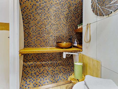 a bathroom with a tiled shower with a bowl on a shelf at 1 Bed in Llanidloes 81415 in Van