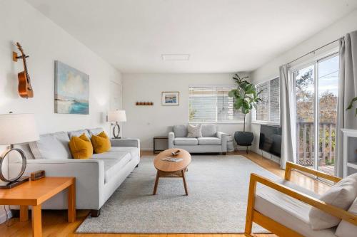 a living room with a couch and a table at Seabright Breeze in Santa Cruz