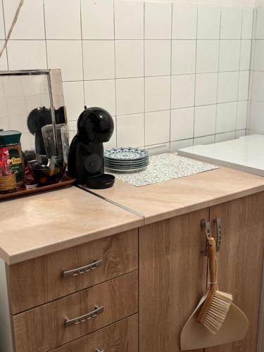 a kitchen counter with a wooden counter top with a whisk at Vikendica Hondo Boracko jezero in Jezero