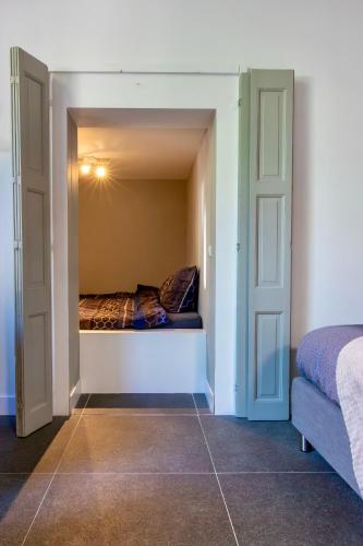 Katil atau katil-katil dalam bilik di "In de Kloosterhof" Gratis privé parkeren