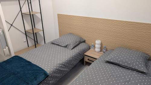 Ένα ή περισσότερα κρεβάτια σε δωμάτιο στο Duplex avec Parking