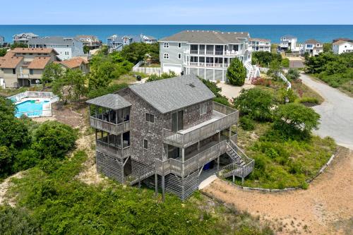 an aerial view of a house on a beach at Sandhill Unit in Duck