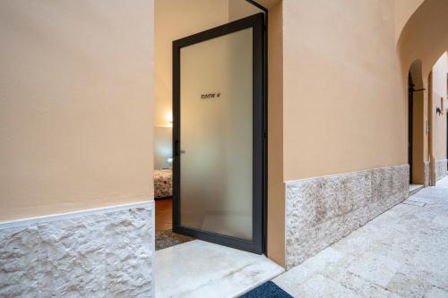 a mirror on the wall of a hallway at Martini Holiday's house in Altamura