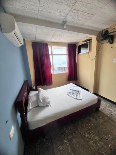 Ένα ή περισσότερα κρεβάτια σε δωμάτιο στο hotel dorado