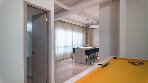a room with a ping pong table and a table at AmazINN Places Luxury Villa El Cangrejo in Panama City