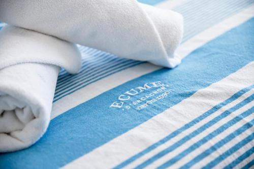 a close up of a towel on a bed at Vue Panoramique sur Bassin,Piscine et terrasse in Arcachon