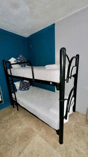 Ein Bett oder Betten in einem Zimmer der Unterkunft Zihua Mia Hotel Boutique