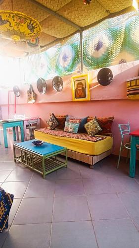 a living room with a couch and a table at Riad SULTANA lateral seaview in Saidia 