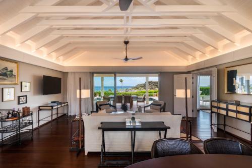 a living room with a coffered ceiling at Rosewood Le Guanahani St Barth in Marigot