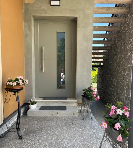 a person is taking a picture in the door of a house at Casa Inès in Conegliano