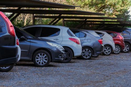 a row of parked cars parked in a parking lot at Altos de Tandil Hotel Boutique & Spa in Tandil
