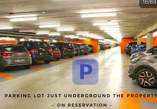 a parking lot with cars parked in it at LIFE VOYAGE & SPA - Strasbourg's City Center Luxury Experience in Strasbourg
