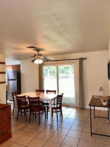 a dining room with a table and chairs at Centrally located Cozy Mid-Century Home in McComb