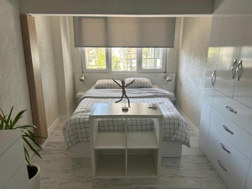 Ένα ή περισσότερα κρεβάτια σε δωμάτιο στο Alex Suites Lara