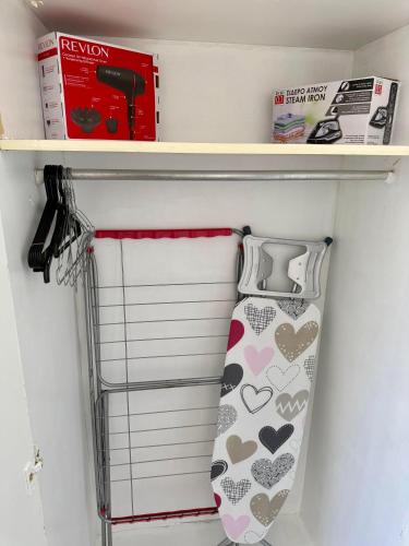a tie on a shelf in a closet at Spitaki 'The Little House by the beach' in Voroklini