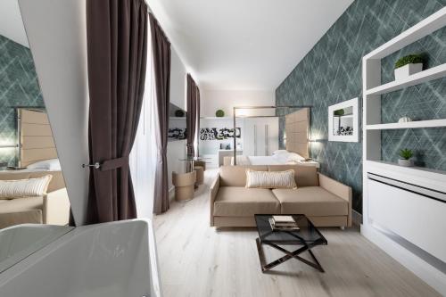 a living room with a couch and a bed at LHP River Club in Florence