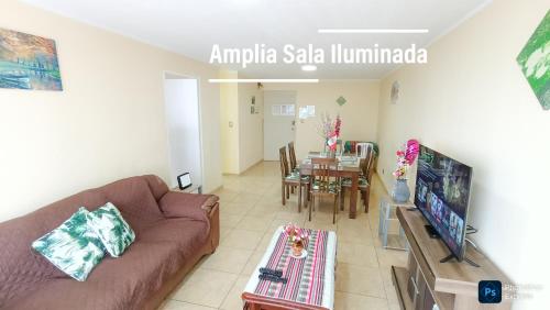 a living room with a couch and a table at FRENTE AL MAR en SAN MIGUEL Apartamento LIMA CHECK IN in Lima