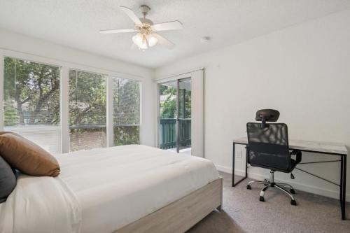 a bedroom with a bed and a desk and a chair at The Trails J252a I Spacious And Comfy 1 Bed 1 Bath in Gainesville