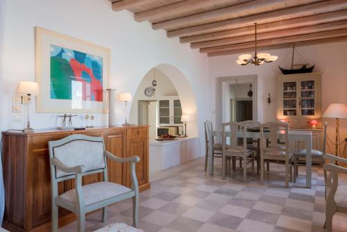 a kitchen and dining room with a table and chairs at House of the sea in Naousa